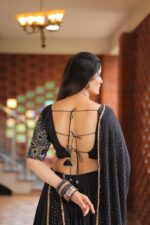 Elegant Black Lehenga Choli with Embellished Border and Dupatta - Image 3